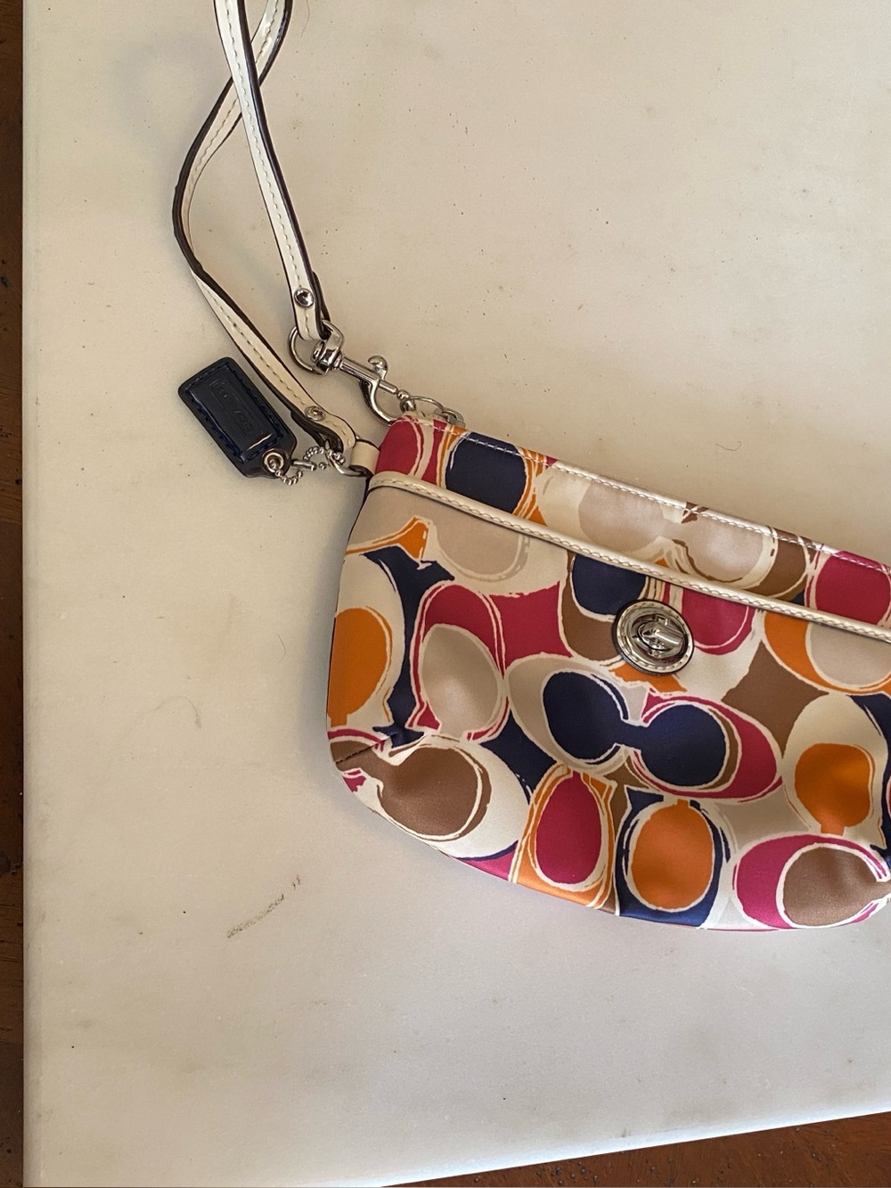 Coach Multicolor Patterned Wristlet Bag - Pink, Navy & Tan with hang tag.